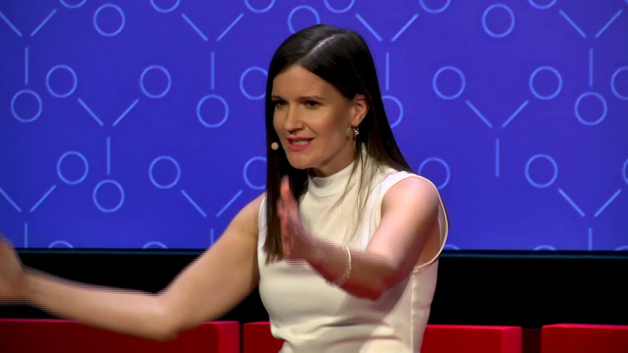 Julia Milner, founder of Theia Moon, speaking at a TEDxTalks event